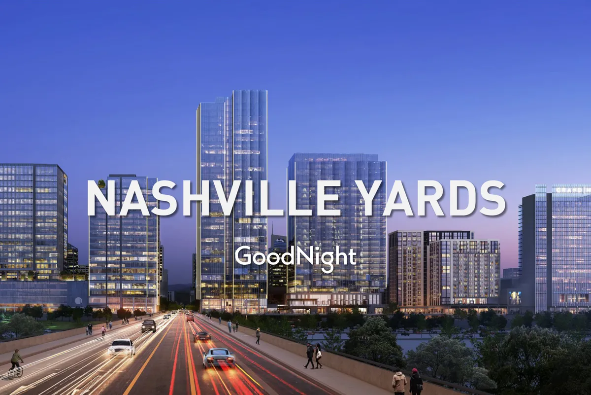 This dynamic exterior shot highlights Nashville's vibrant city skyline illuminated at night, with a busy roadway hinting at easy access and lively urban energy. The city lights evoke nightlife, cultural events, and the city's ever-active spirit.