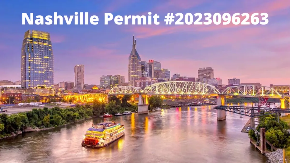 A sweeping view of the Nashville skyline at sunset, with the river in the foreground, a classic riverboat, and urban buildings lit by the warm glow. The sky is colorful, and the scene feels festive and dynamic, hinting at nearby live music and downtown attractions.