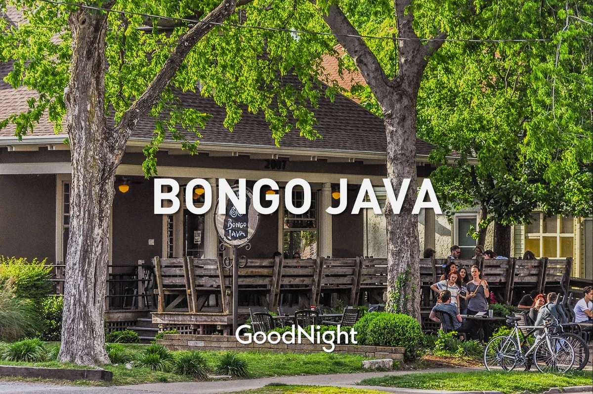 The image captures the exterior of Bongo Java, a local coffee shop with inviting outdoor seating. People are seen relaxing and enjoying coffee on the patio, highlighting the casual, pet-friendly ambiance of the neighborhood.